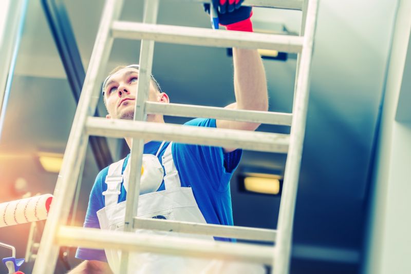 Handyman Fixing a Ladder